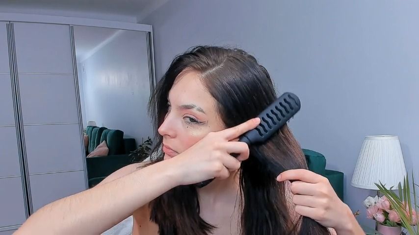 cute teen brushing her hair - Jan 9, 2023