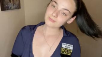 Teen police officer plays with toy (Tiffanybabe01)