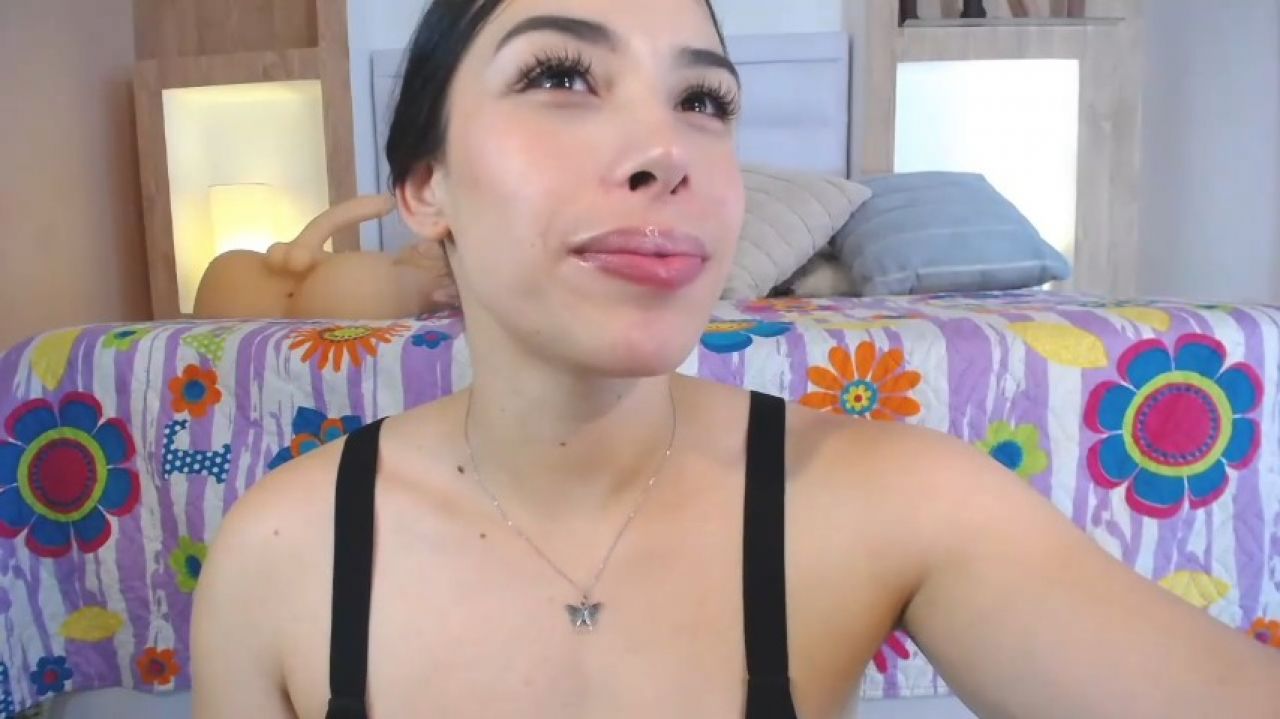 Orgasmic woman bounces breasts while throat fucking herself