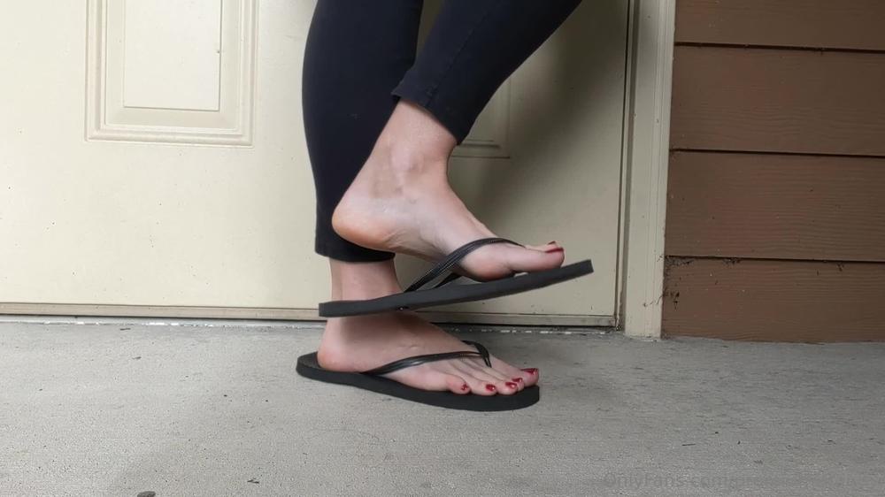 premiumbrandy 01 12 2022 2701316128 red toes flip flop play outside on the porch showing off these red toes in my black flip f
