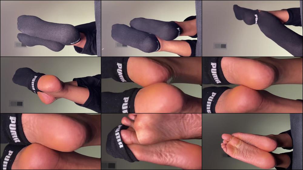 Black Puma Socks Removal On Couch